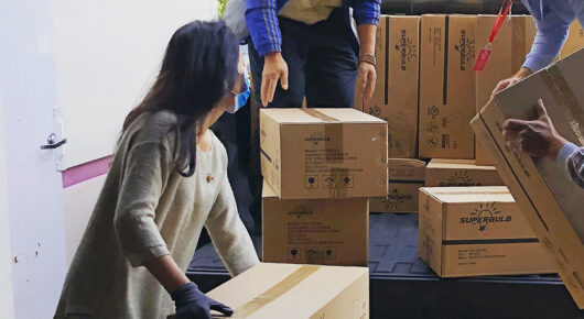Workers packing boxes