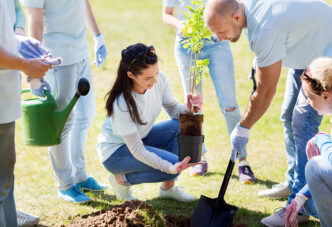 Giving Back Matters: People planting a tree